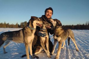 Zbynek cuddling dogs
